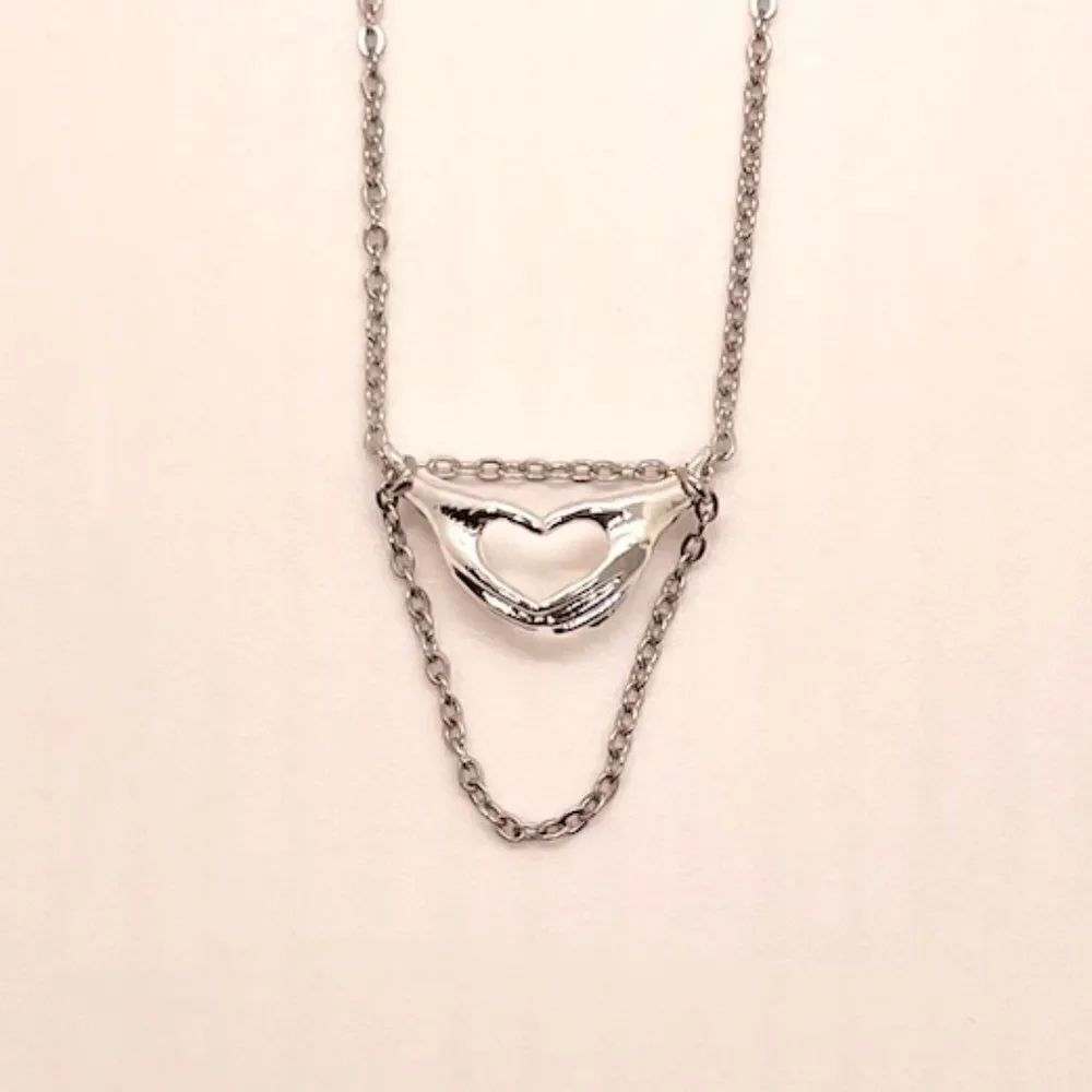 HighMaintenanceHippie Heart & Hands Necklace in (Silver & Stainless Steel)